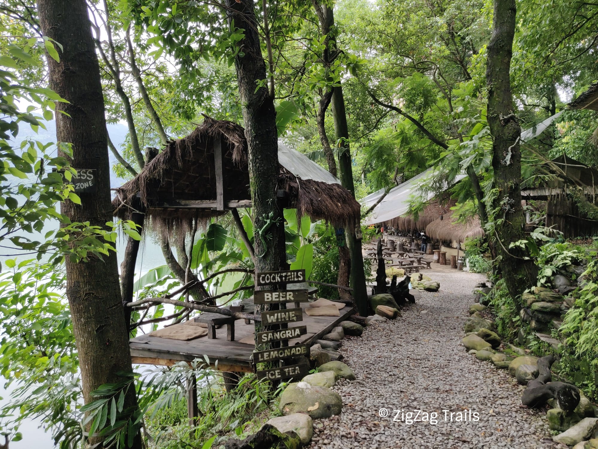 The entrance of Krazy Gecko Restaurant covered with Trees, lush green restaurant at the bank of Lake Phewa