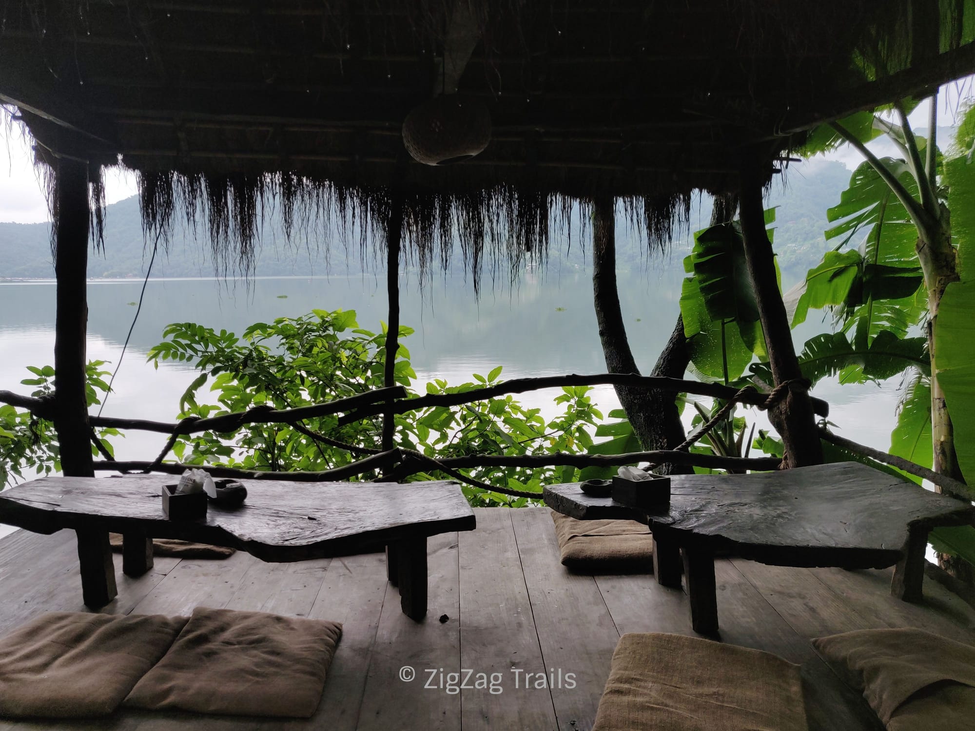 Seating area in Krazy Gecko near lake.