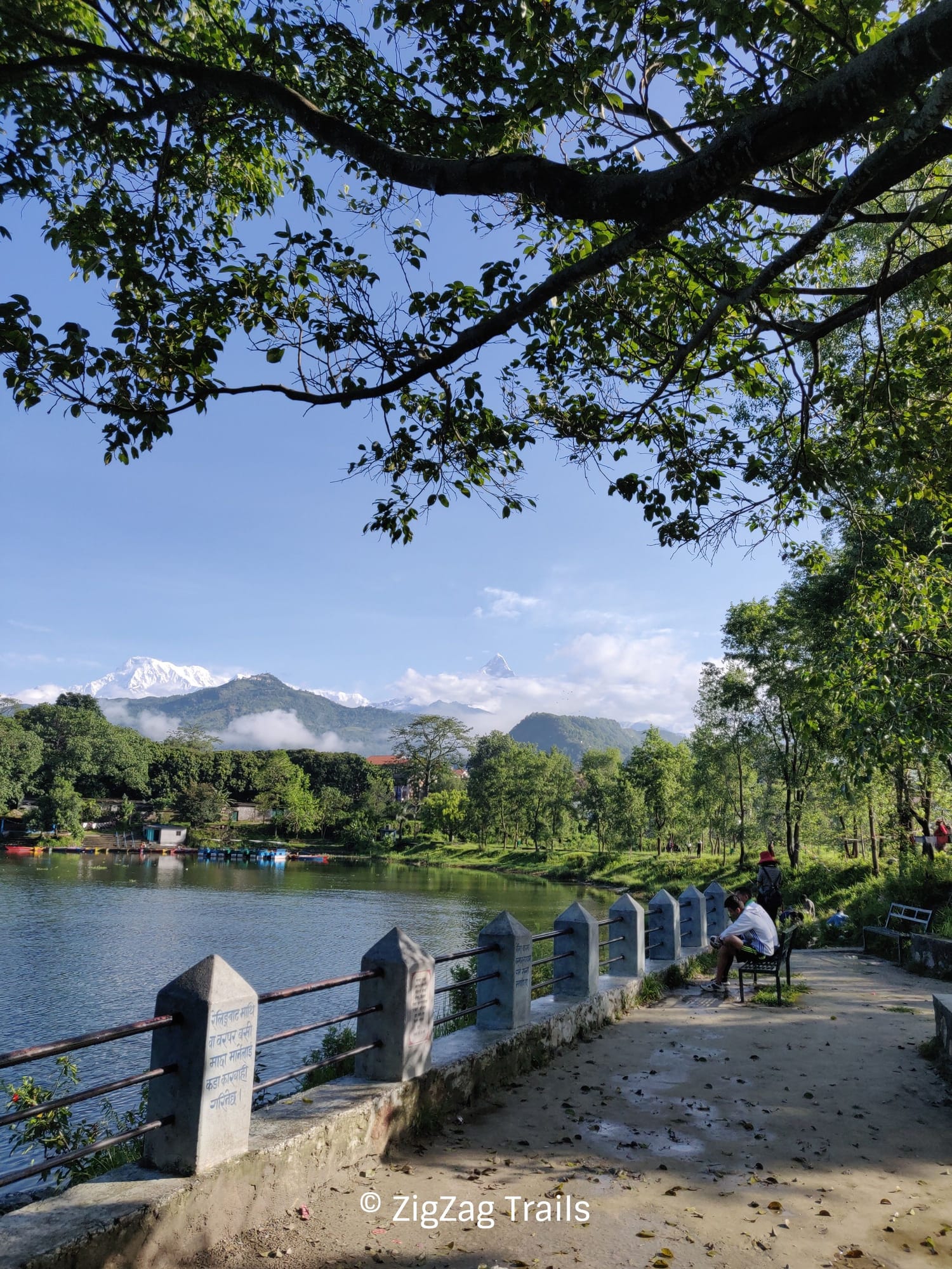 Walk around lake phewa with view of Annaourna on a clear, sunny day.