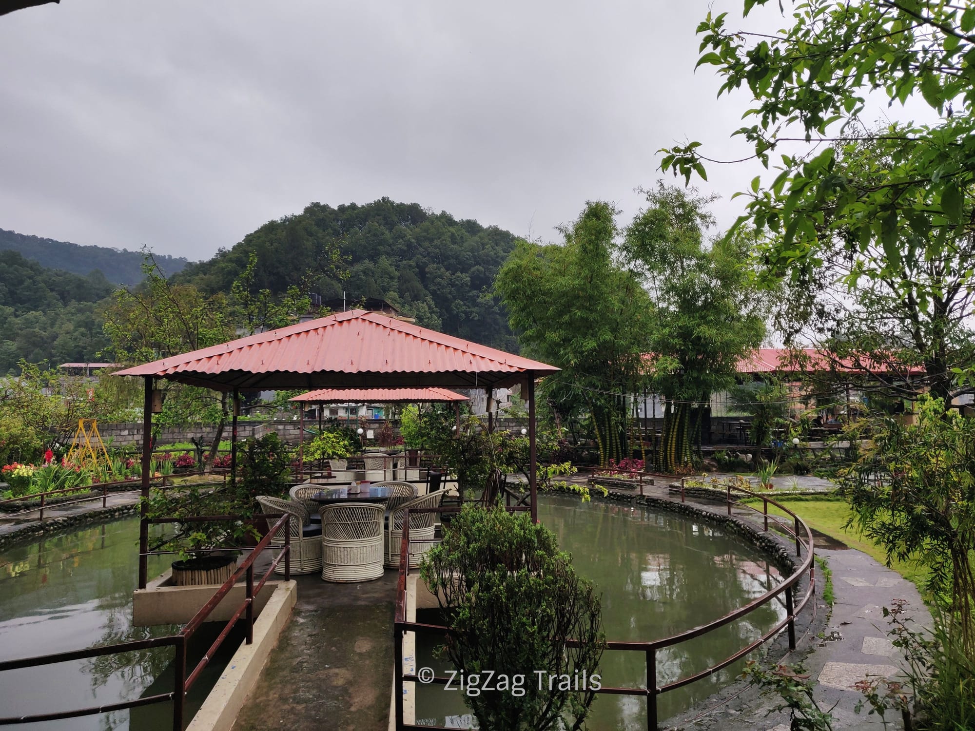 The seating area surrounded by a tiny pond at Zostel Pokhara