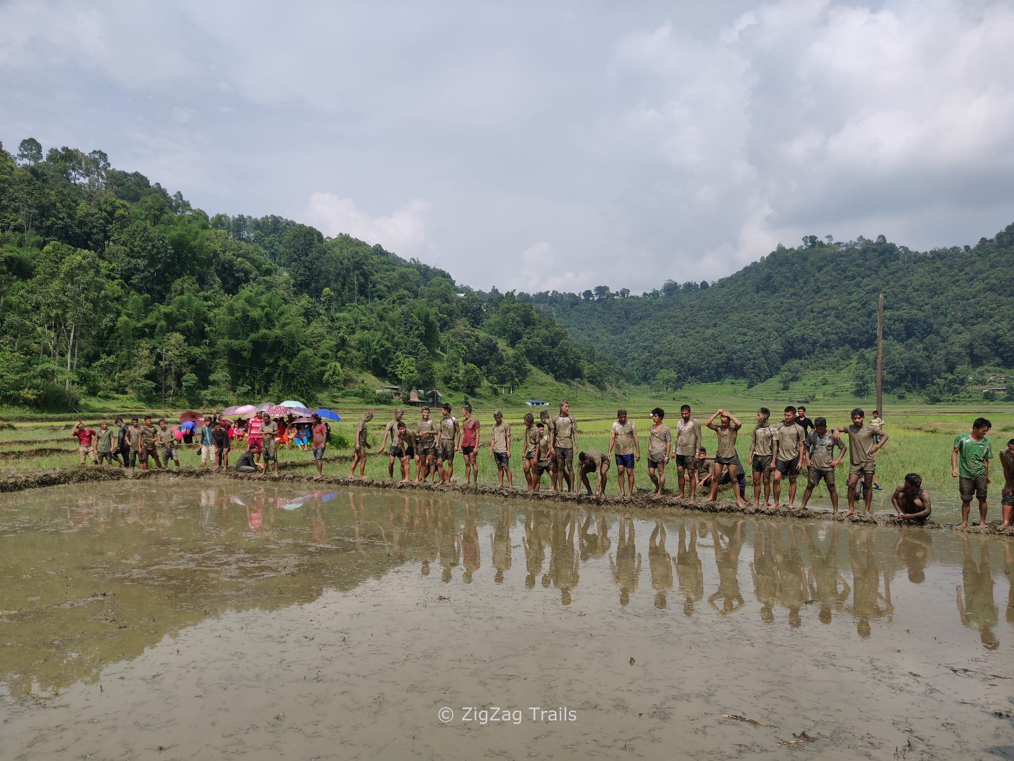The boys getting ready for the run in paddy fields during Ropai-Jatra festival. 